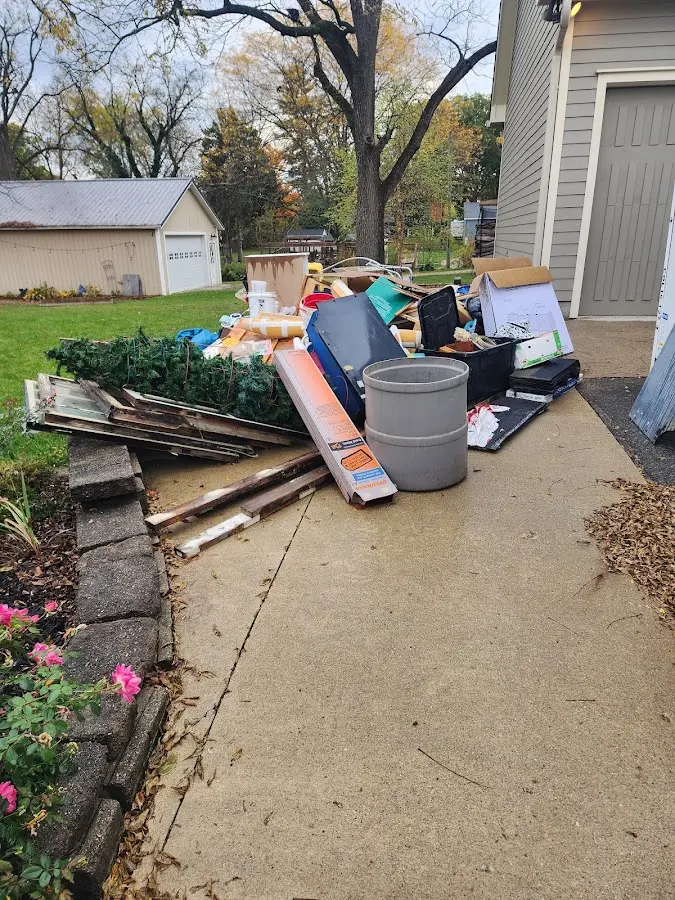 Dumpster being loaded with debris for Estate Cleanout Dumpster Rental in Sonoma